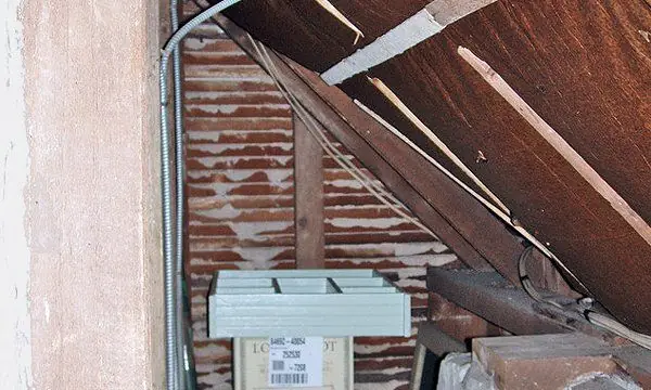 Attic corner with a junction box, checked as part of an RGS inspection